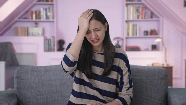 Upset Indian girl slapping her head