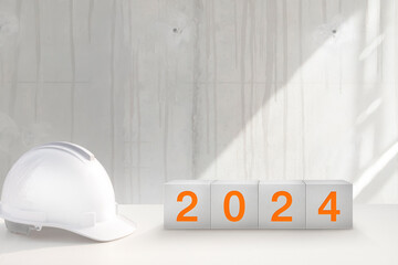 Happy New Year 2024 for construction industry. Construction worker prepares to celebrate the new...