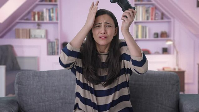 Sad Indian girl losses a video game