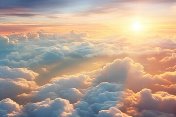 The sun shining above the clouds in the sky - Powered by Adobe