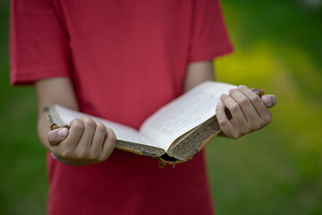 Hold an open book in your hands.Search for information in old books. Outdoor training. Read a story in nature.
