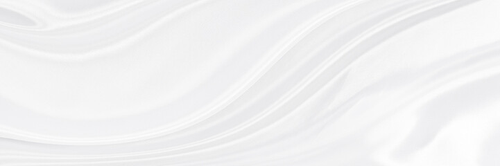 White gray satin texture that is white silver fabric silk panorama background with beautiful soft...
