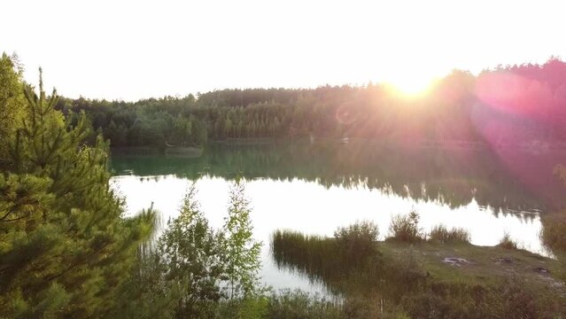 a small forest lake at sunset 60 fps