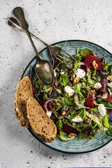 Fresh green salad, ruccola, different lettuce, cottage cheese or ,feta cheese, beetroot and seasoning with wholegrain bread - 647766229