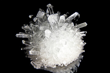 Closeup view of big sharp shiny diamond crystal isolated on black background. Geology and...
