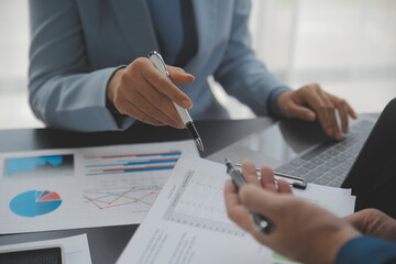 Financial Business team present. Business man hands hold documents with financial statistic stock photo, discussion, and analysis report data the charts and graphs. Finance Financial concept - obrazy, fototapety, plakaty