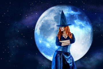 Fototapeta na wymiar Witch on Halloween. Female wizard fairy character for All Saints' Day. Fantasy gothic red-haired Vampire girl in black dress. Enchantress dressed in carnival costume
