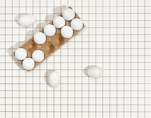Top view of egg container. Organic white chicken eggs on morning breakfast. Copy space for text.