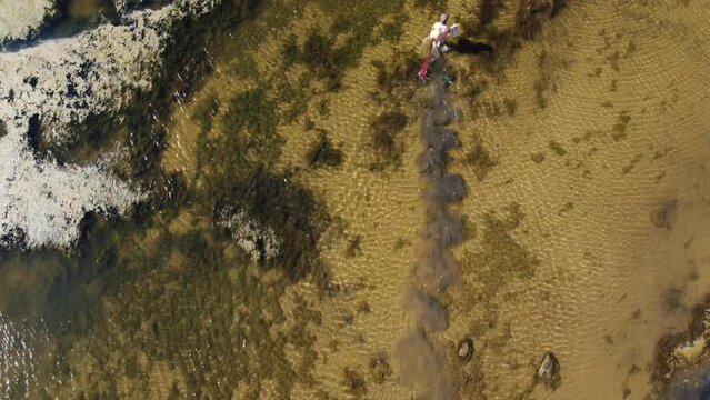 fisherman walking on lake bafa