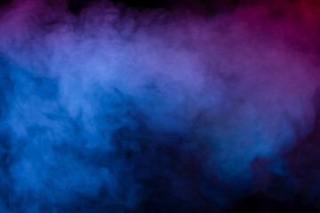 Obraz na płótnie Canvas Blue and purple steam on a black background.