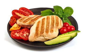 Grilled chicken breast served with vegetables, isolated on white background.