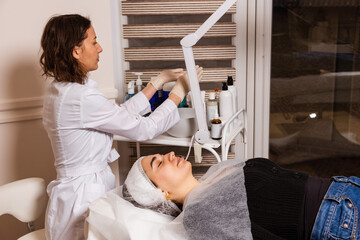 Reception, examination and procedures at the doctor of the skin care clinic