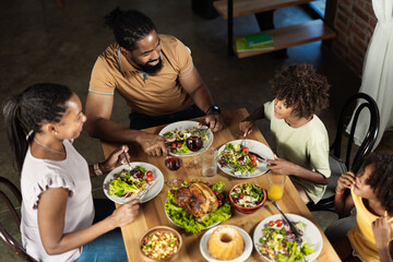 High angle view of African American family having Thanksgiving dinner at dining table