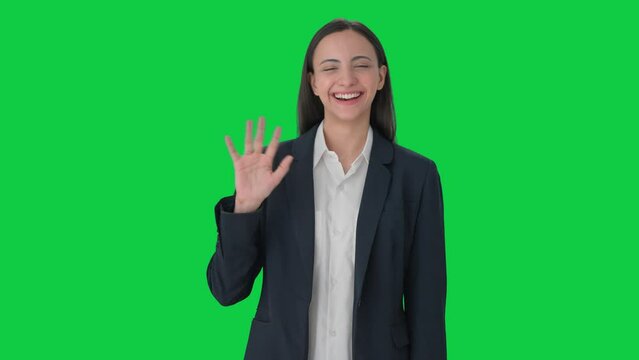 Happy Indian Business Woman Waving Hi To The Camera Green Screen