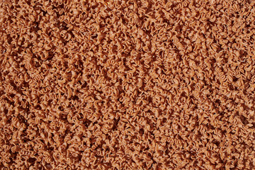 Brown pasta fusilli noodle abstract background