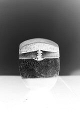 An interesting and unusual stone container in black and white film negative.