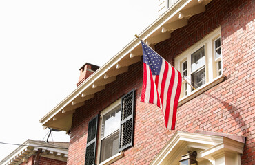 Fototapeta na wymiar US flag proudly displayed at home symbolizes patriotism, pride, and independence
