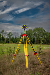 Surveyors with instruments on railway track near green forest in south Bohemia