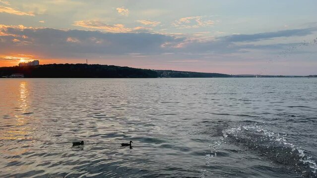 Ternopil lake embankment with evening sunset and sky