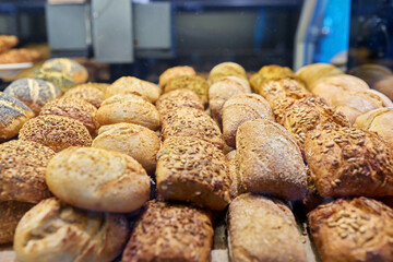Close-up of bakery pastry shop display with fresh buns