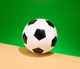 A soccer ball on a green background. Game, competition and sport.