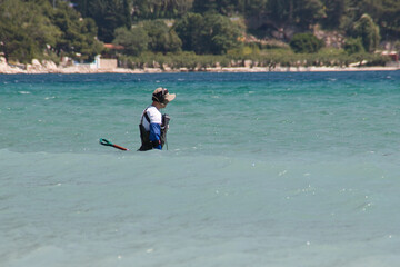 a man with metal detector in the adriatic sea searching for the lost treasure