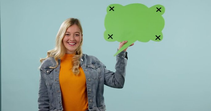 Woman, speech bubble and voice with communication in studio, tracking marker and mockup on blue background. Opinion, dialogue and FAQ with social media, review or feedback in conversation with chat