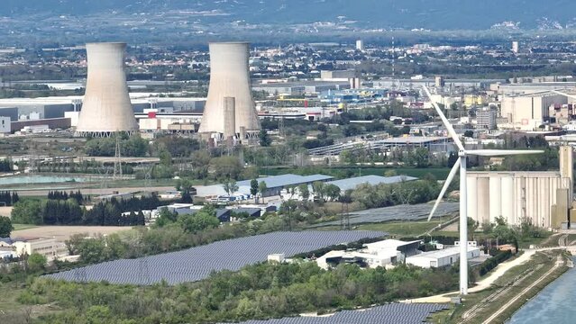 nuclear power station next to wind turbine and solar panels aerial view France sunny day 