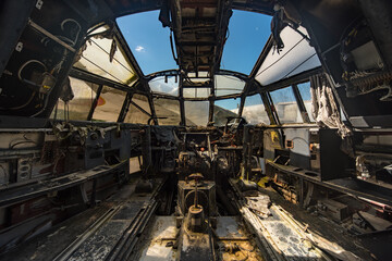 Fototapeta na wymiar Decayed cockpit of an military airplane