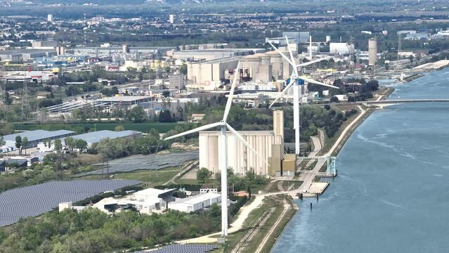 Energy power station nuclear wind and solar electricity aerial shot next to a river France