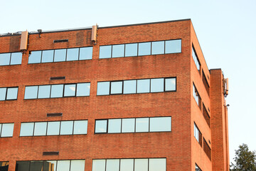 brick building with arched windows, symbolizing stability and growth in the business and mortgage...