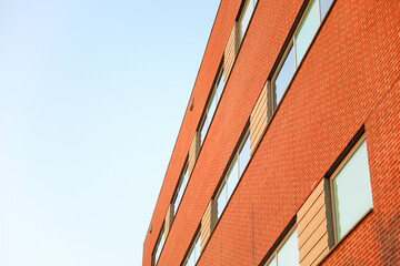 brick building with arched windows, symbolizing stability and growth in the business and mortgage...