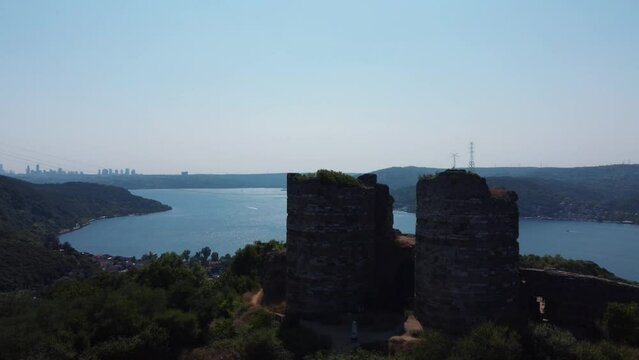 Bosphorus view and a castle from the Eastern Roman period. The bastions of the entrance gate of the castle are still standing. Istanbul is located on the Asian side of the Bosphorus.