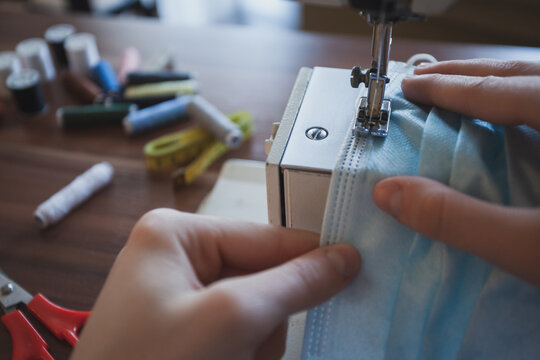A young seamstress sews a wardrobe and develops her small business