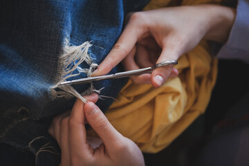 A young seamstress sews a wardrobe and develops her small business