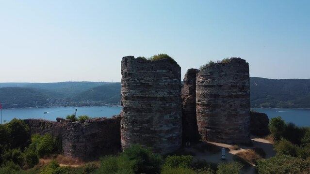 Bosphorus view and a castle from the Eastern Roman period. The bastions of the entrance gate of the castle are still standing. There is the third largest Bosphorus bridge at the back.