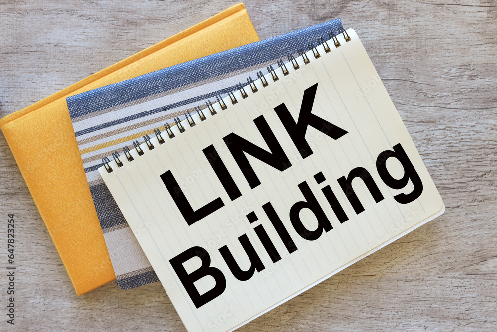 Poster link building top view of a notepad with text. notepad with spring