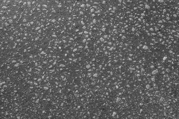 Asphalt background texture with grain pebble. Top view. Close-up.