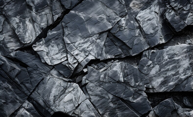 Black and white stone texture. Dark gray stone granite background for design. Rough cracked surface of a mountain. Close-up. Cracked. 