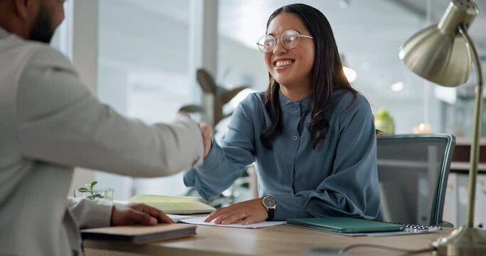 Happy asian woman, handshake and interview in hiring, meeting or partnership for teamwork at office. Business people shaking hands in recruiting, b2b or thank you for agreement or deal at workplace