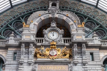 Store enrouleur Anvers Hall with clock and sign with the Dutch city name Antwerpen in the city of Antwerp in Belgium.