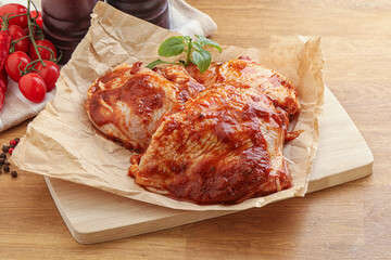 Marinated chicken leg in tomato sauce