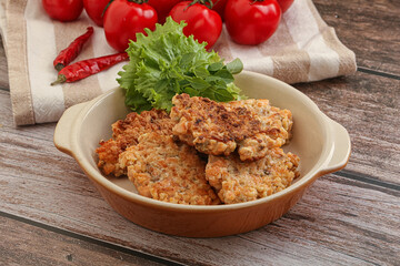 Fried salmonn cutlet in the bowl