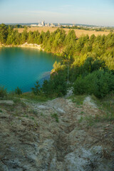 Aerial photography of a flooded sand pit from a drone. A sand mine for cement production. Beautiful industrial aeroplane. Mining industry. Mining with the help of a drone and modern technologies.