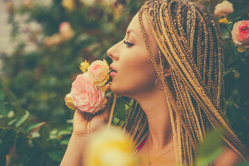 Nature beauty portrait. Woman in rose garden. Portrait of gorgeous women. Perfect look. Natural...