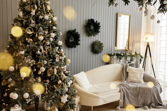 Beautiful holiday decorated room with Christmas tree and bright lights , out of focus shot for photo background. Blur christmas background