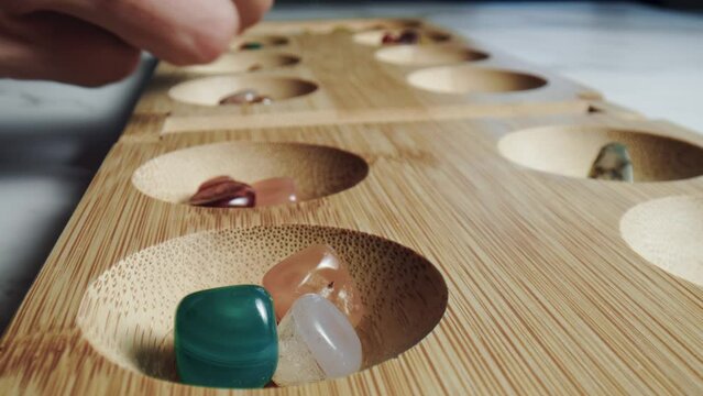 People playing mancala traditional African board game