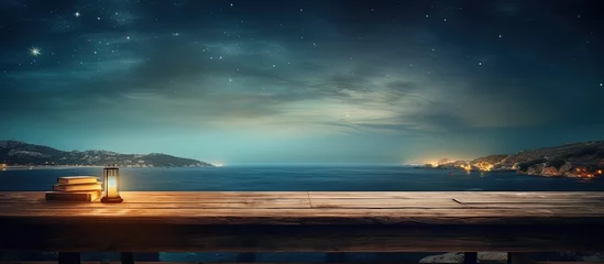 Fototapeten Nighttime sea and empty wooden desk © AkuAku