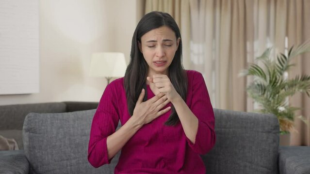 Sick Indian woman suffering from acidity