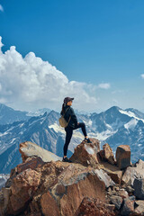 girl on top of snow-capped mountains